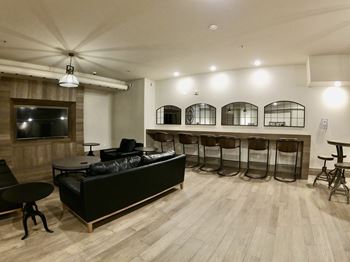 Creekside Common room living room filled with furniture and a flat screen tv